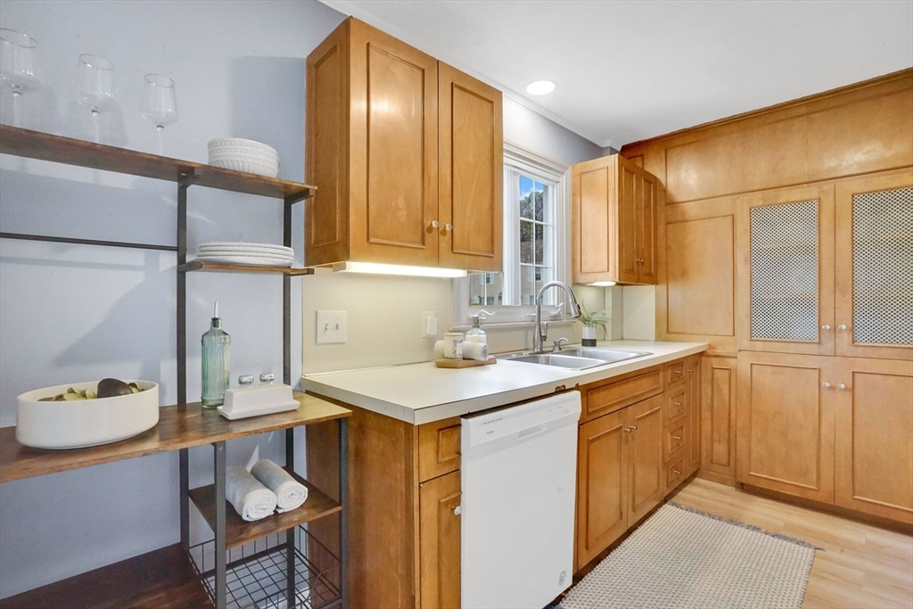81 Oak Hollow Road Springfield, MA 01128 - Photo 4 of 42 a kitchen with a sink cabinets and dining table
