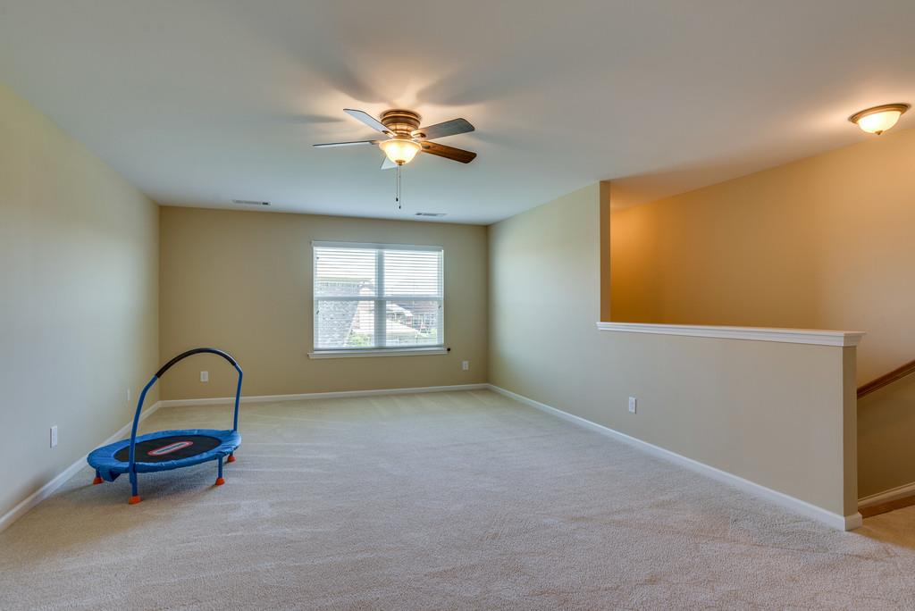 4009 Pendleton Drive Spring Hill, TN 37174 - Photo 22 of 30 The upstairs bonus room is a great place to have Movie Night and enjoy a rainy day playing inside.