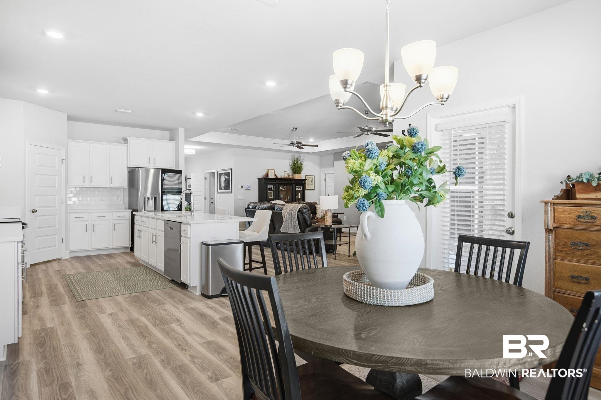 11123 Genuine Risk Circle Daphne, AL 36526 - Photo 24 of 67 Dining room featuring suspended lighting, a ceiling fan, and light wood-style flooring