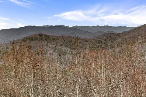 a view of a town with mountains in the background