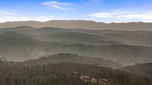a view of a town with mountains in the background