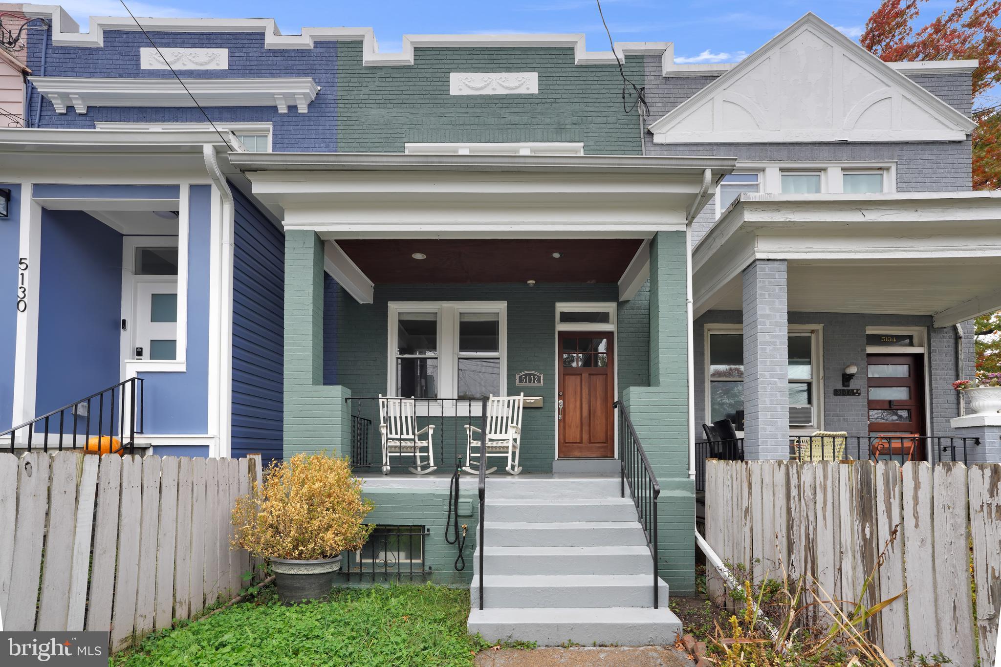 a view of a house with a small yard and a large window