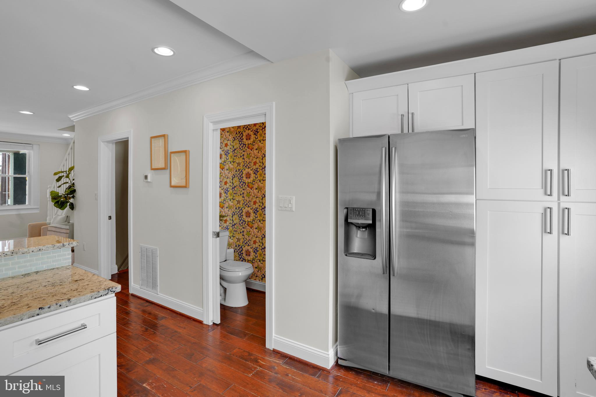 5132 7th Street Northwest Washington, DC 20011 - Photo 11 of 34 a kitchen with stainless steel appliances granite countertop a refrigerator and a sink