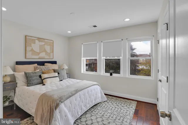 a bedroom with a large bed and a window