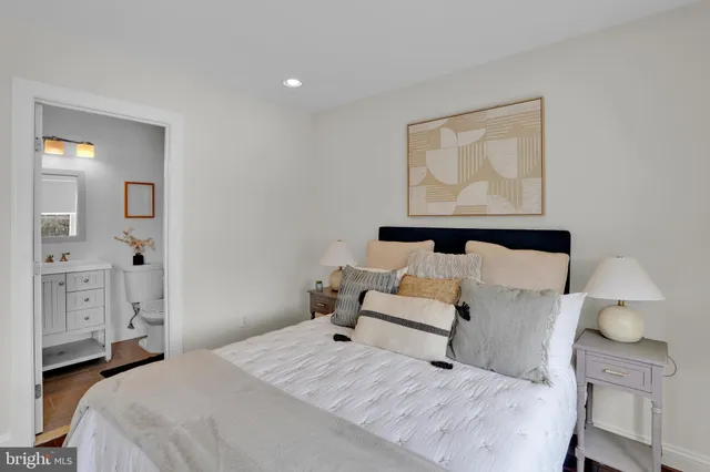 a bedroom with a bed and lamp