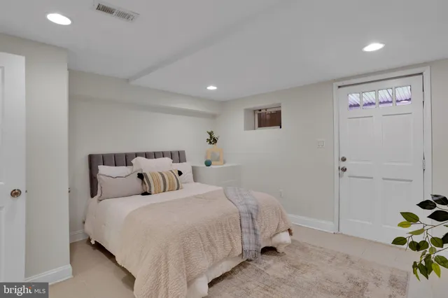 a bedroom with bed and a closet