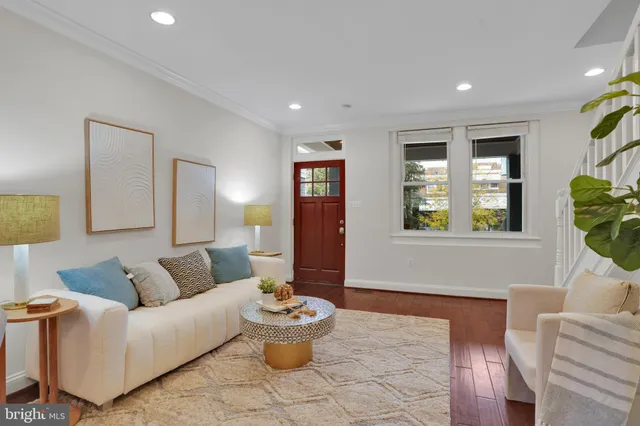 a living room with furniture and window
