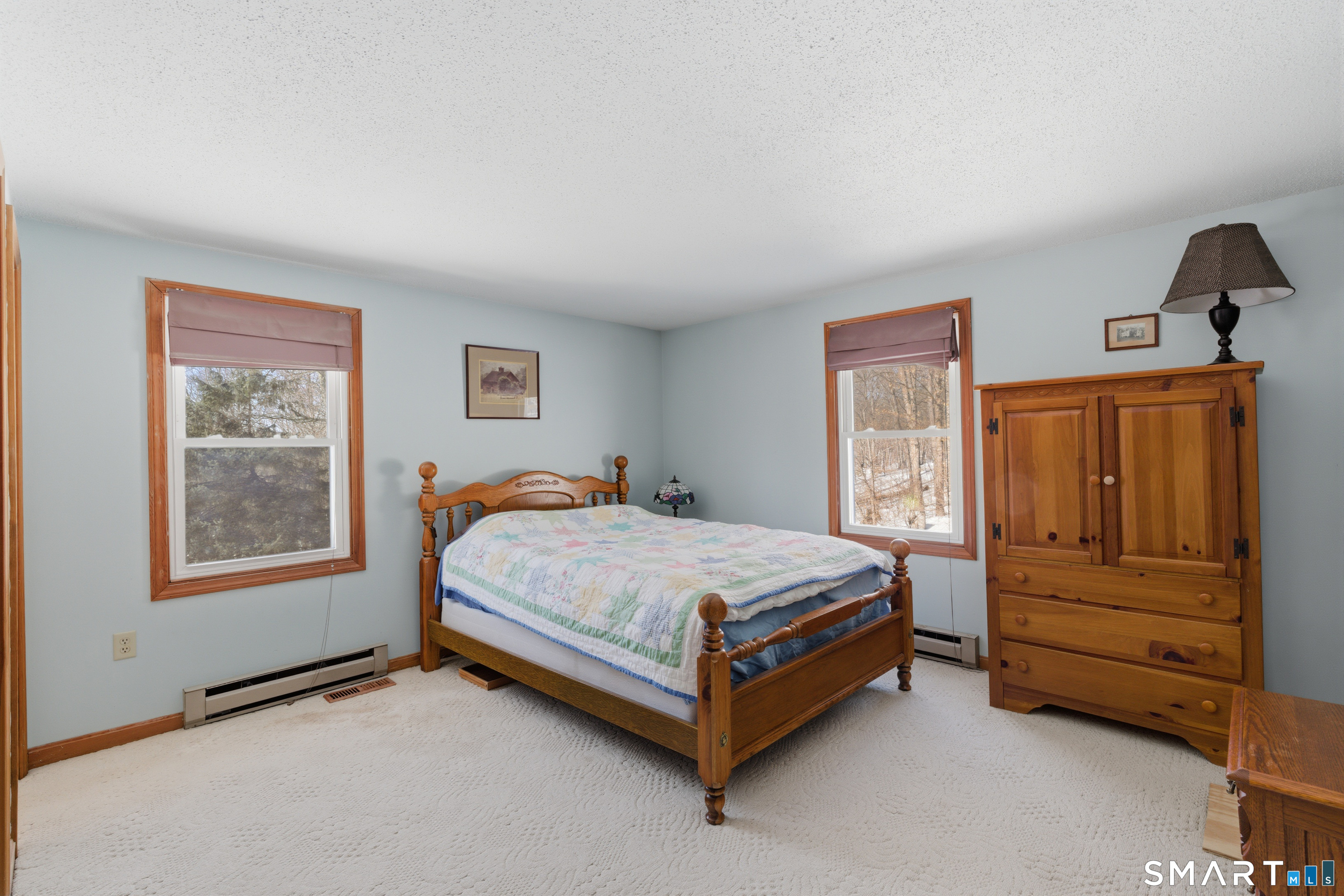 1616 Weed Road Torrington, CT 06790 - Photo 16 of 40 a bed sitting in a bedroom next to a window