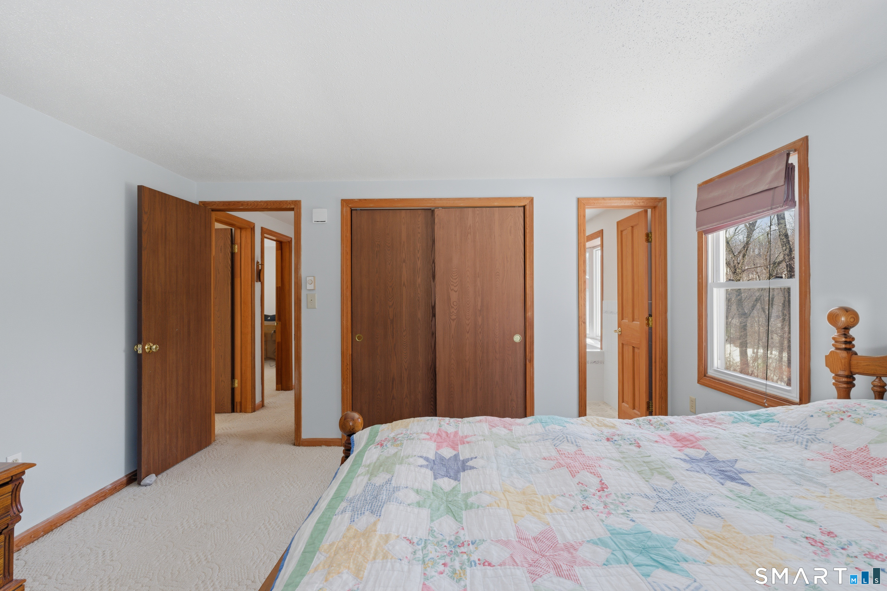 1616 Weed Road Torrington, CT 06790 - Photo 18 of 40 a bedroom with a bed and wooden floor