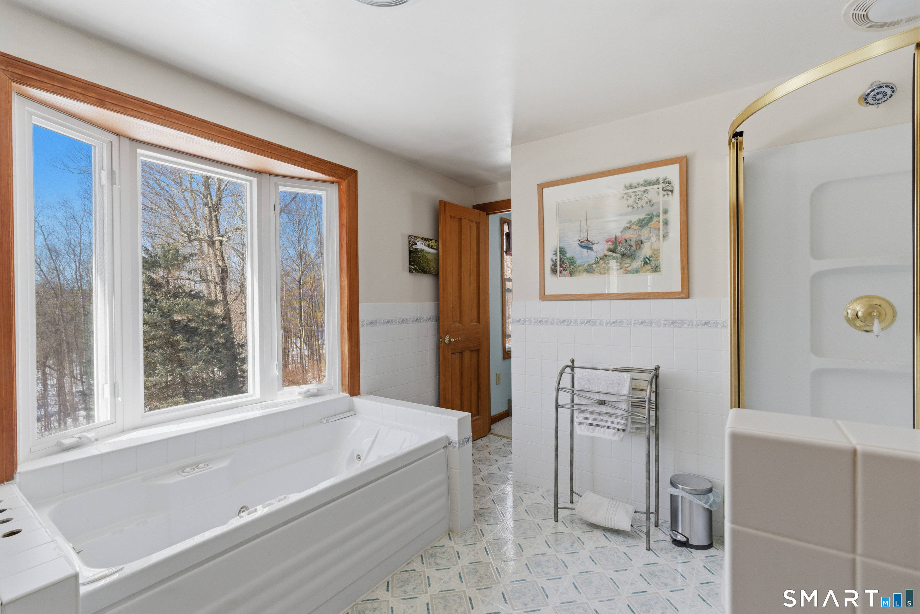 1616 Weed Road Torrington, CT 06790 - Photo 21 of 40 a spacious bathroom with a bathtub and next to a window