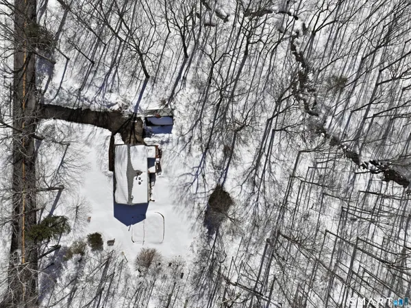 a view of white house with a yard