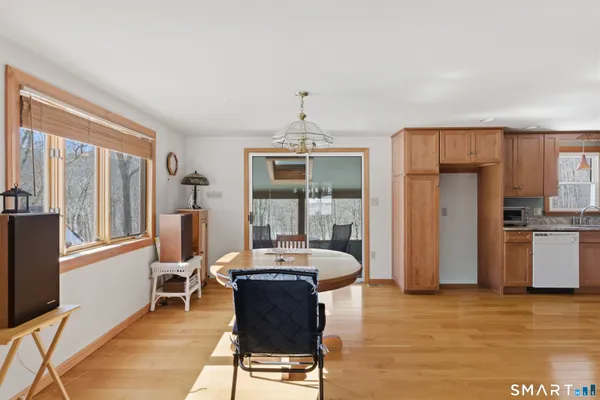 a living room with furniture and a kitchen