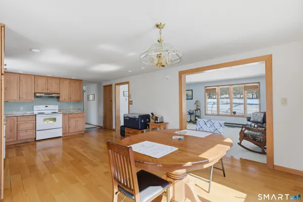 a view of a dining room with furniture window and wooden floor