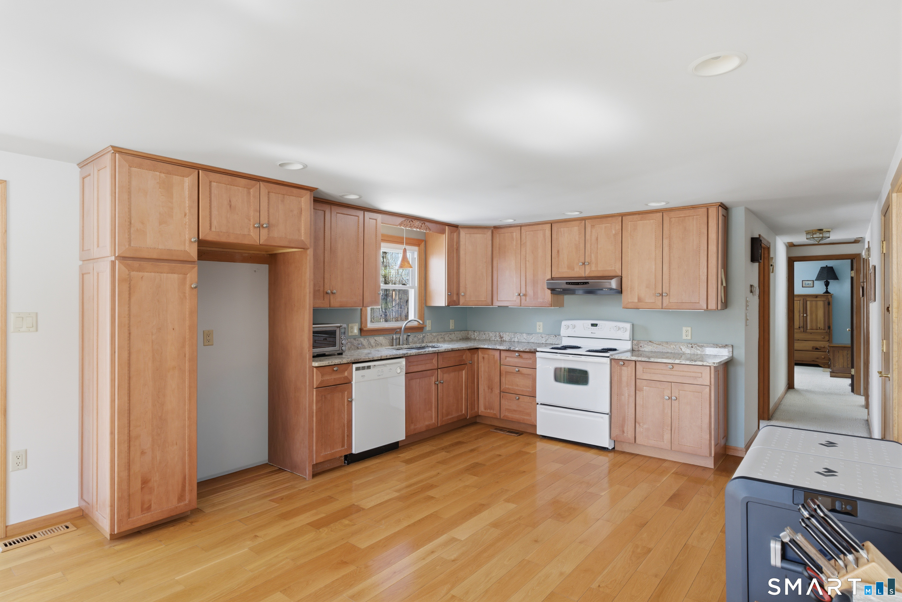 1616 Weed Road Torrington, CT 06790 - Photo 8 of 40 a kitchen with a refrigerator stove top oven and sink