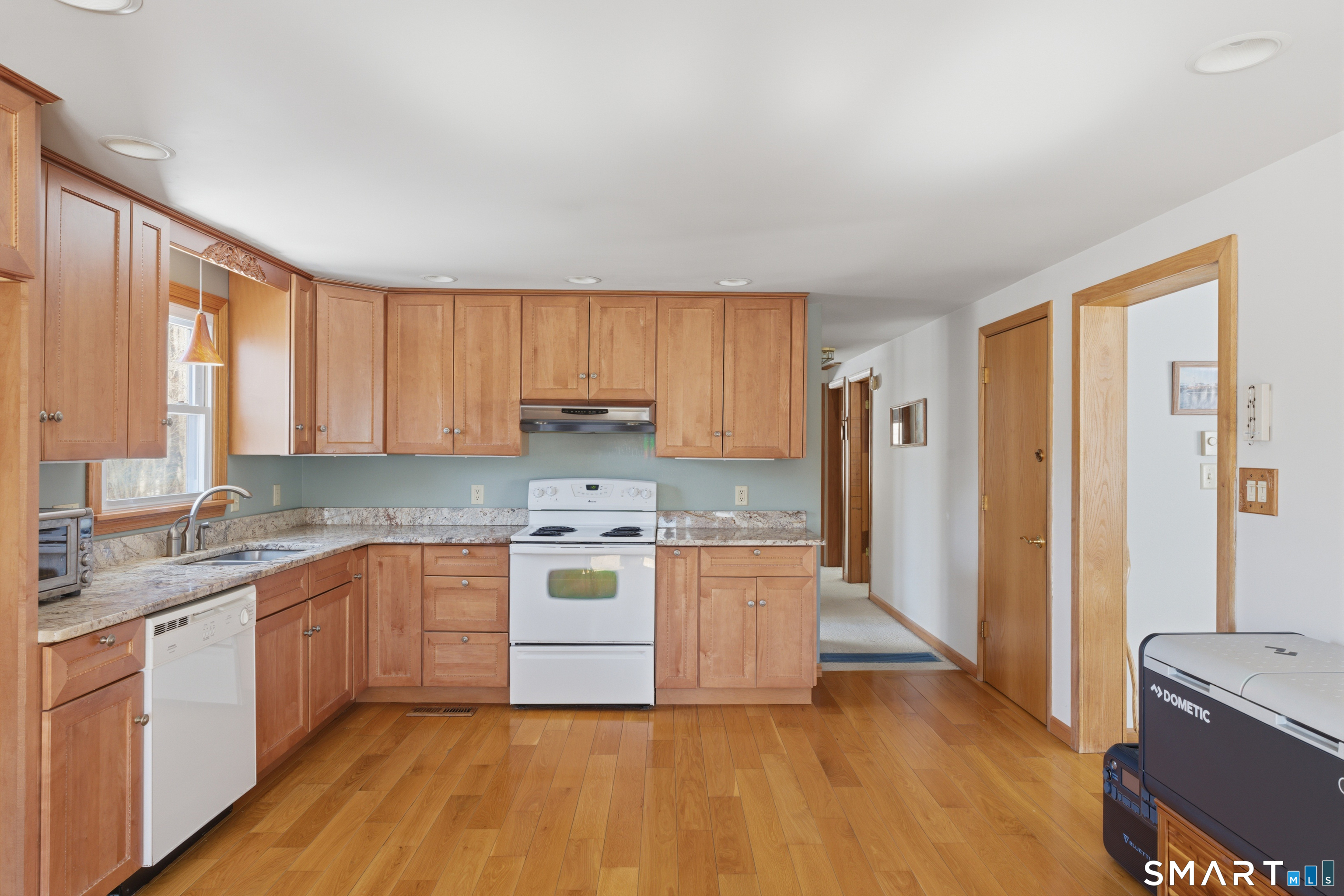 1616 Weed Road Torrington, CT 06790 - Photo 9 of 40 a kitchen with stainless steel appliances granite countertop a stove a sink dishwasher and a refrigerator