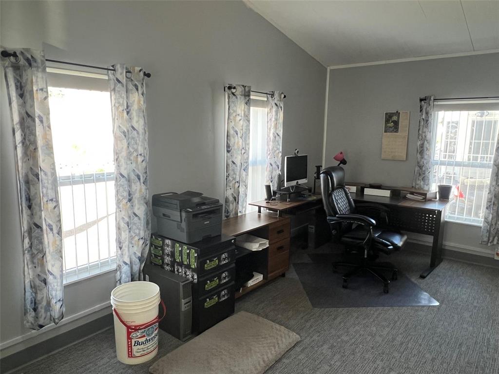 1001 Starkey Road, Unit 731 Largo, FL 33771 - Photo 16 of 35 a living room with furniture and a large window