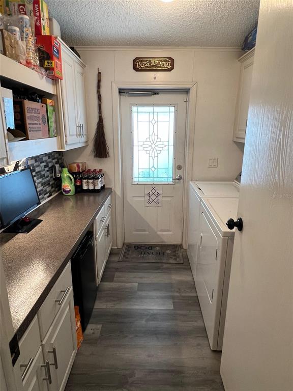 1001 Starkey Road, Unit 731 Largo, FL 33771 - Photo 17 of 35 a hallway with a washer and dryer