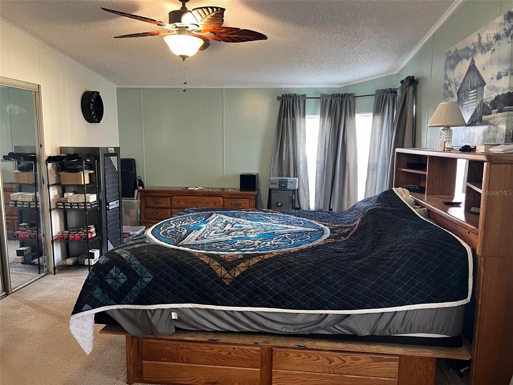 1001 Starkey Road, Unit 731 Largo, FL 33771 - Photo 20 of 35 a living room with kitchen appliances and a fireplace