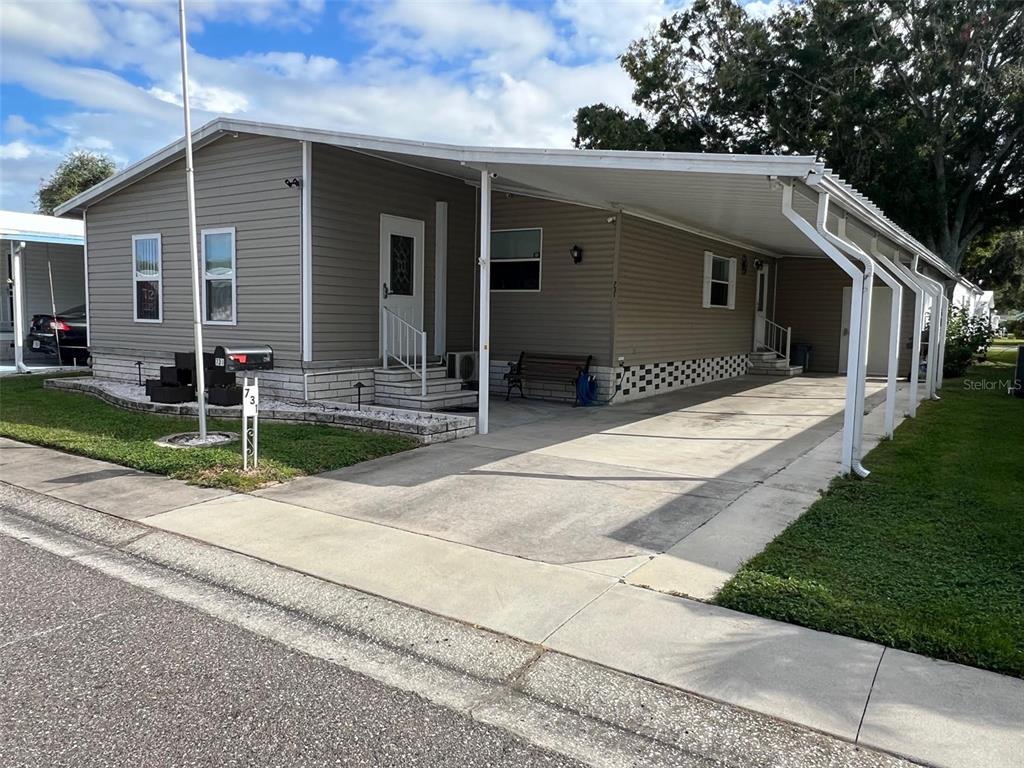 1001 Starkey Road, Unit 731 Largo, FL 33771 - Photo 2 of 35 a backyard of a house with seating space