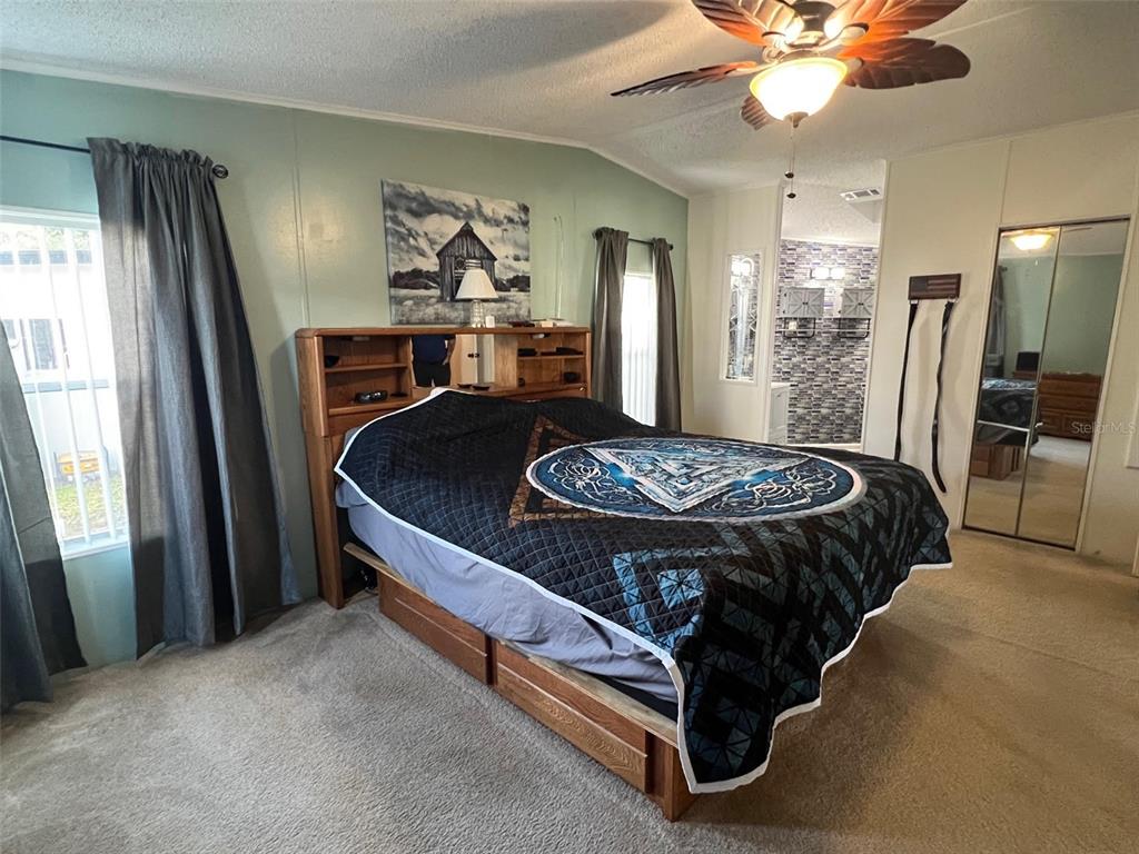 1001 Starkey Road, Unit 731 Largo, FL 33771 - Photo 22 of 35 a bed sitting in a room next to a window