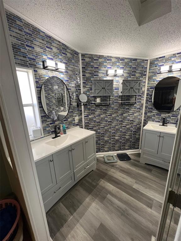 1001 Starkey Road, Unit 731 Largo, FL 33771 - Photo 23 of 35 a bathroom with a sink a mirror and shower