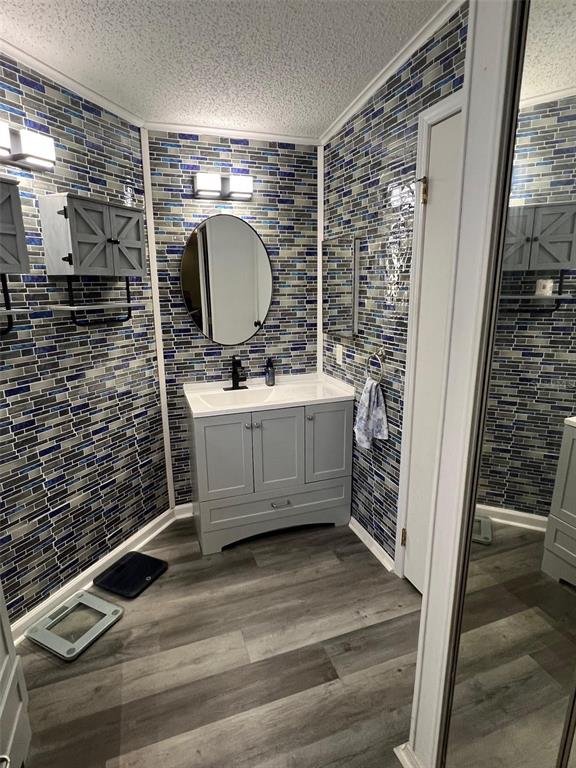 1001 Starkey Road, Unit 731 Largo, FL 33771 - Photo 24 of 35 a bathroom with a sink a mirror and shower