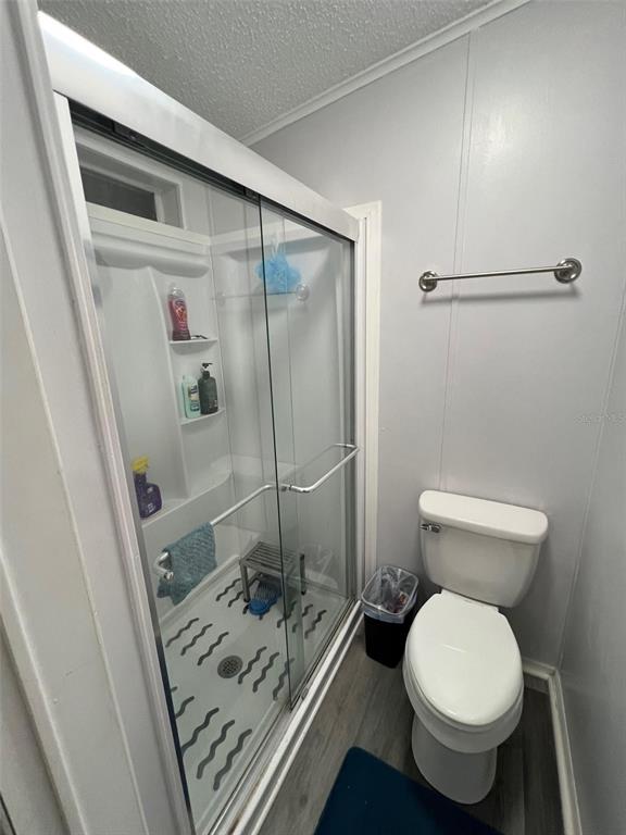 1001 Starkey Road, Unit 731 Largo, FL 33771 - Photo 26 of 35 a bathroom with a toilet and a shower