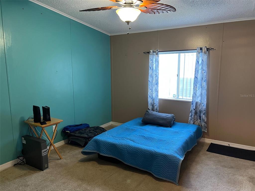 1001 Starkey Road, Unit 731 Largo, FL 33771 - Photo 28 of 35 a bedroom with a bed and a window