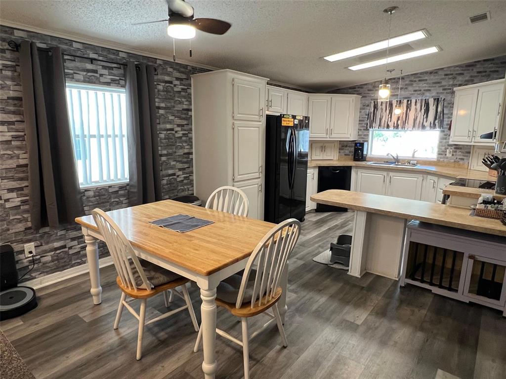 1001 Starkey Road, Unit 731 Largo, FL 33771 - Photo 3 of 35 a view of a dining room with furniture and window