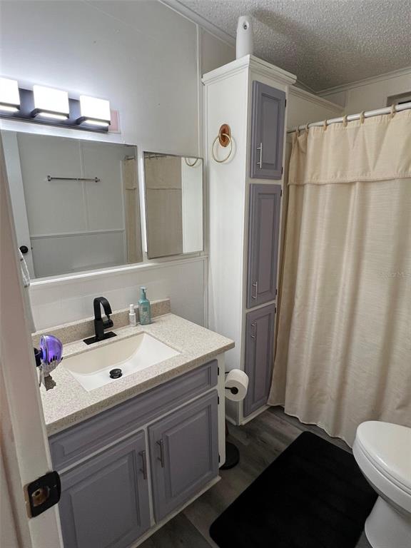 1001 Starkey Road, Unit 731 Largo, FL 33771 - Photo 31 of 35 a bathroom with a sink and a mirror