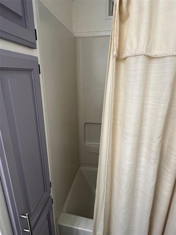 1001 Starkey Road, Unit 731 Largo, FL 33771 - Photo 33 of 35 a bathroom with a shower and a sink