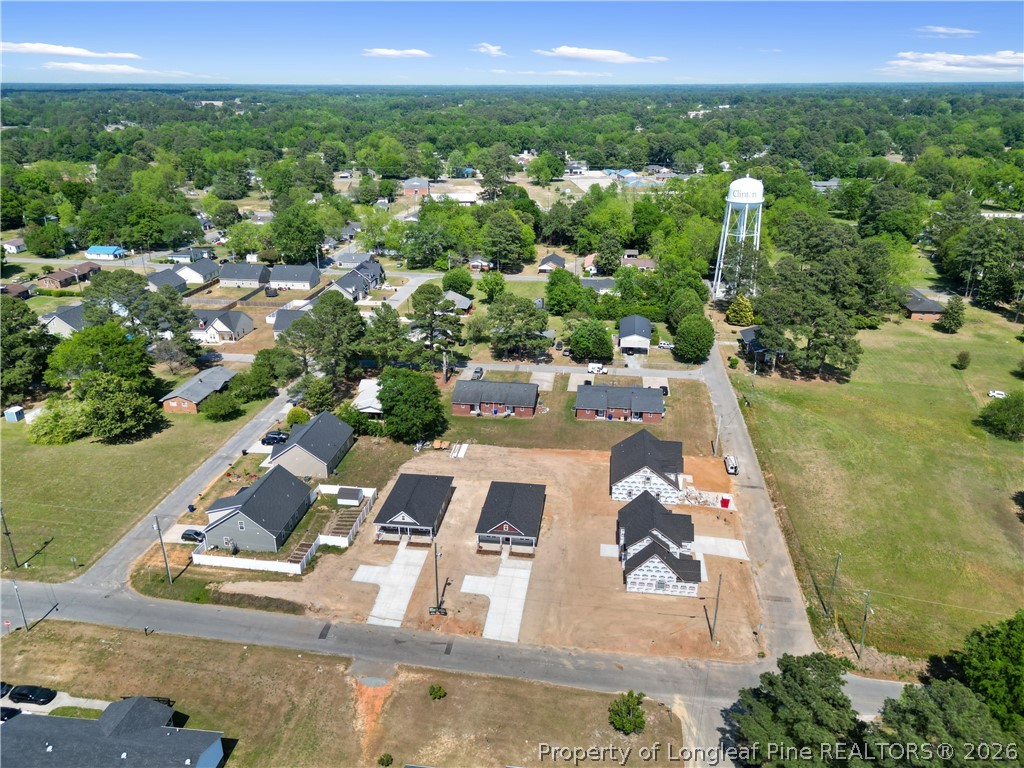 802 Holmes Street Clinton, NC 28328 - Photo 29 of 31 an aerial view of residential houses with outdoor space and lake view