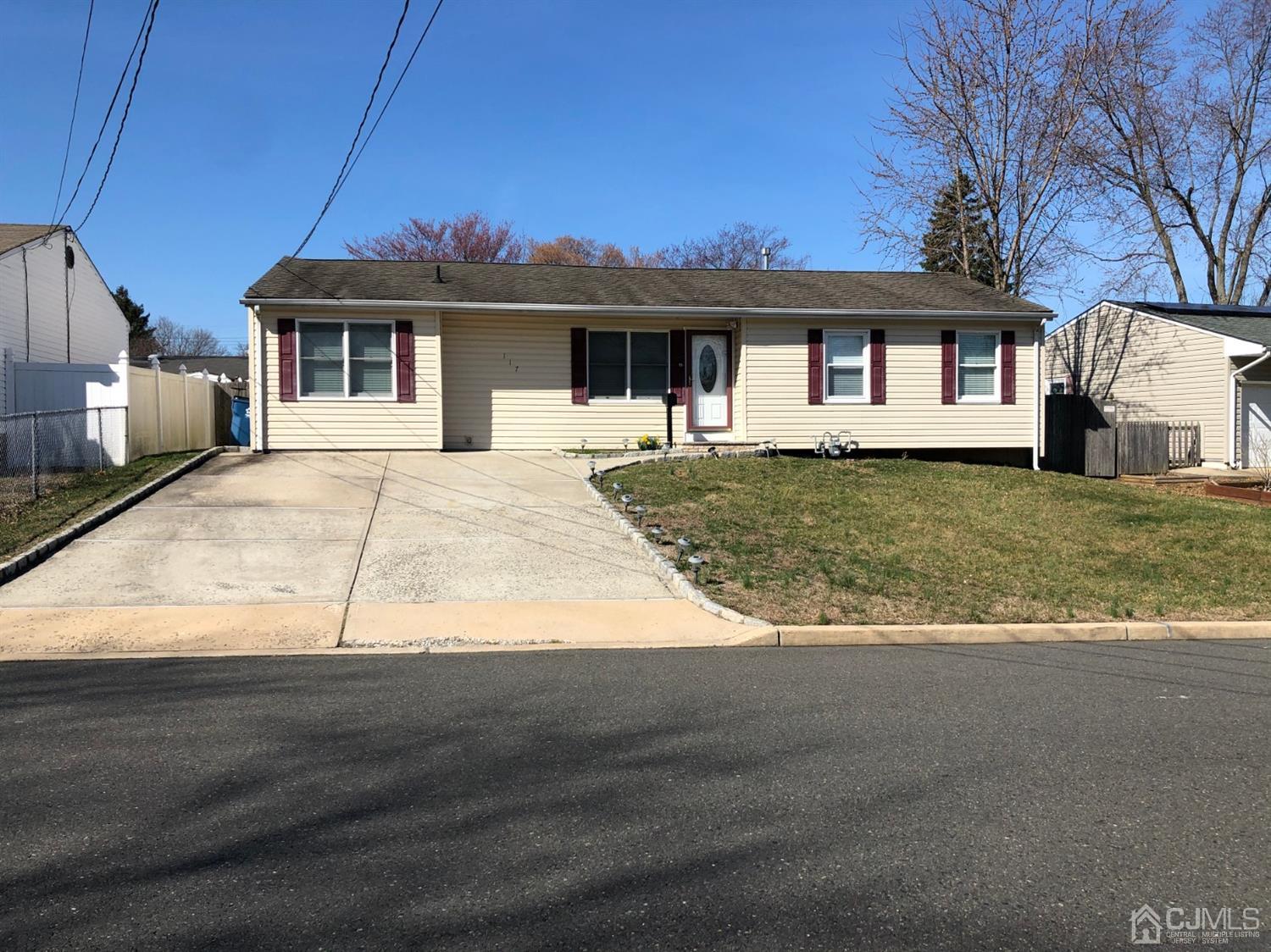 117 Princeton Road Old Bridge, NJ 08859 - Photo 2 of 19 a front view of a house with a garden and yard