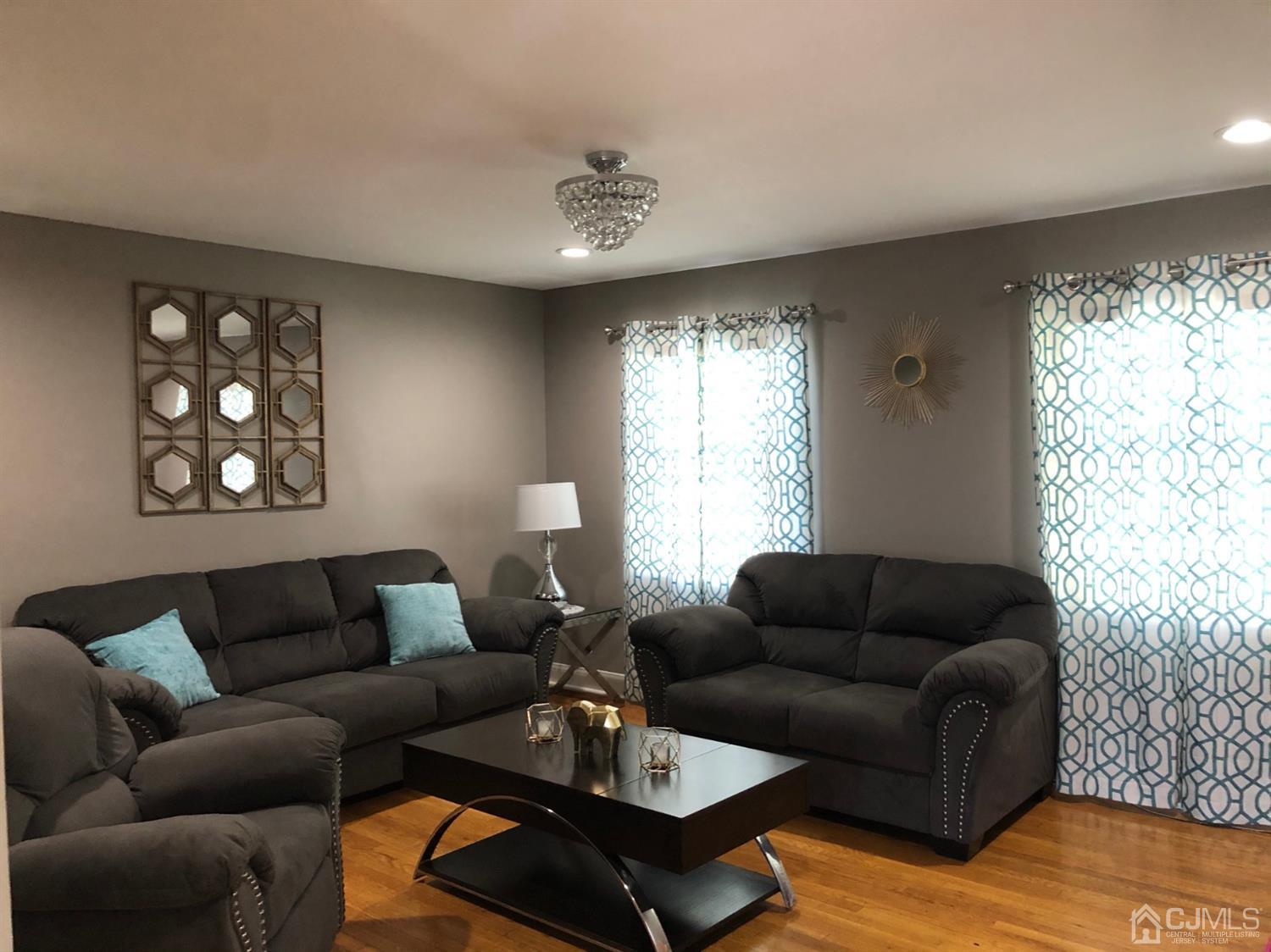 117 Princeton Road Old Bridge, NJ 08859 - Photo 12 of 19 a living room with furniture and a large window