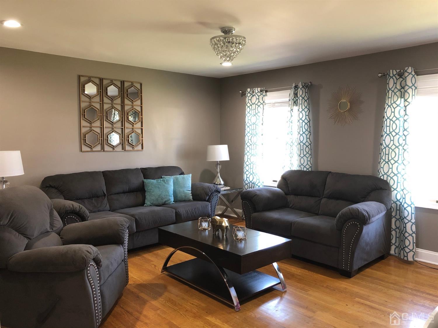 117 Princeton Road Old Bridge, NJ 08859 - Photo 13 of 19 a living room with furniture and a large window