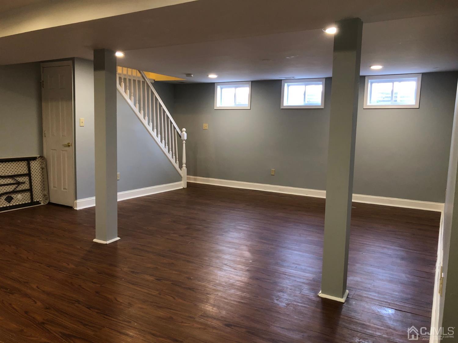 117 Princeton Road Old Bridge, NJ 08859 - Photo 19 of 19 an empty room with wooden floor and windows