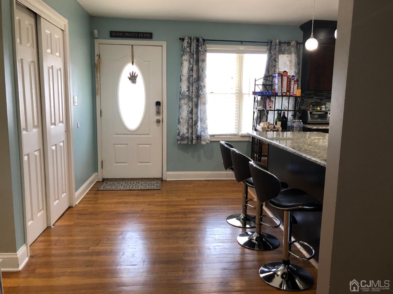 117 Princeton Road Old Bridge, NJ 08859 - Photo 6 of 19 a view of workspace with wooden floor mirror and windows