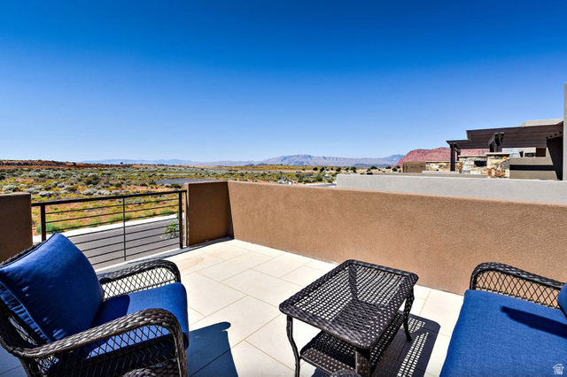 1622 Canyon Tree Drive St. George, UT 84770 - Photo 23 of 34 Outdoor patio featuring a tiled surface, stucco walls, and a contemporary metal railing