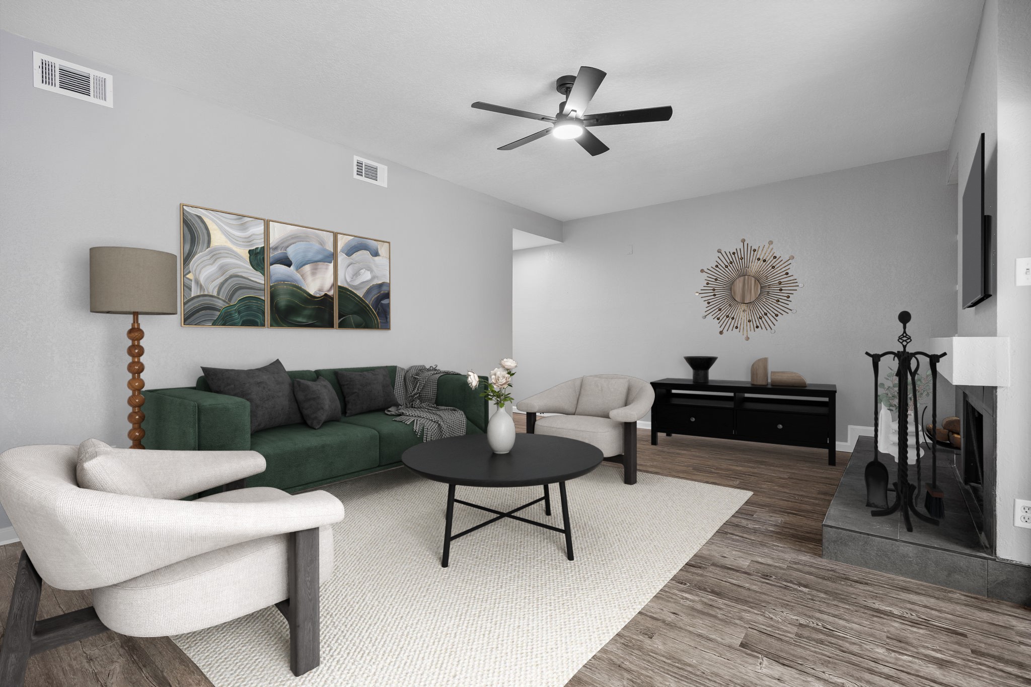 4711 Spicewood Springs Road, Unit 1106 Austin, TX 78759 - Photo 3 of 19 Spacious living area featuring wood-finish flooring, a contemporary ceiling fan, and a fireplace with a tile hearth