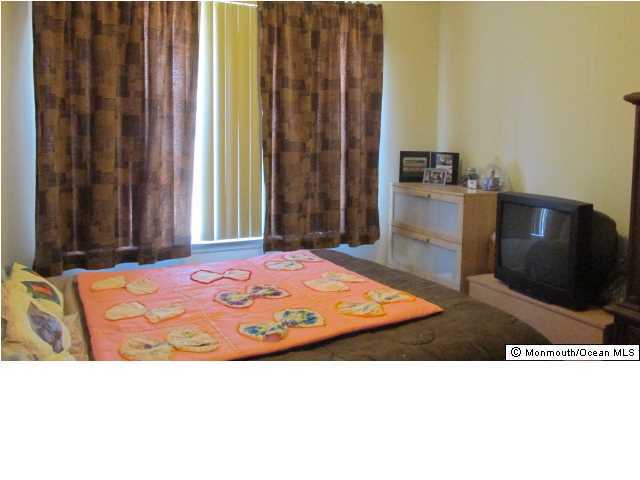 424 Diamond Road Jackson, NJ 08527 - Photo 11 of 22 a bedroom with a bed and a television