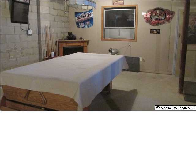 424 Diamond Road Jackson, NJ 08527 - Photo 17 of 22 a bedroom with a bed and a wall painting