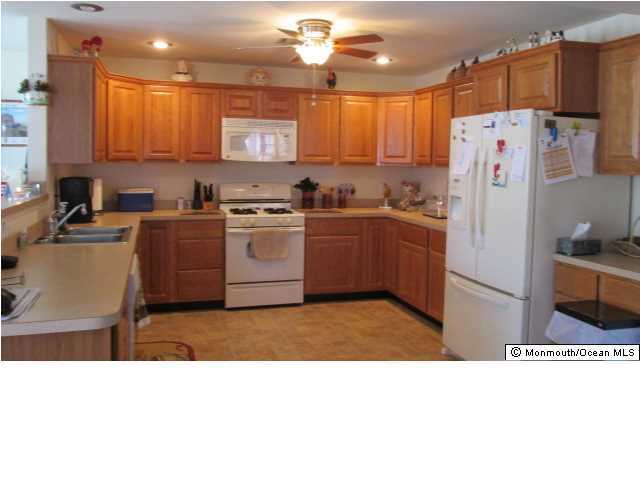 424 Diamond Road Jackson, NJ 08527 - Photo 2 of 22 a kitchen with refrigerator and cabinets