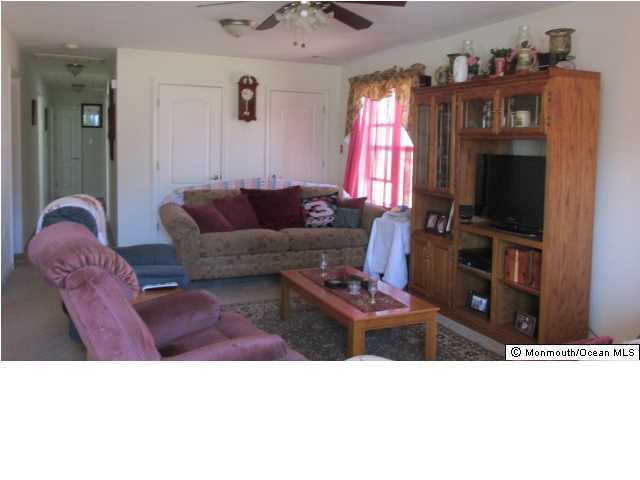 424 Diamond Road Jackson, NJ 08527 - Photo 6 of 22 a living room with furniture a flat screen tv and a window