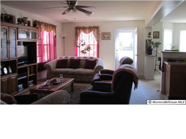 424 Diamond Road Jackson, NJ 08527 - Photo 8 of 22 a living room with furniture and a flat screen tv