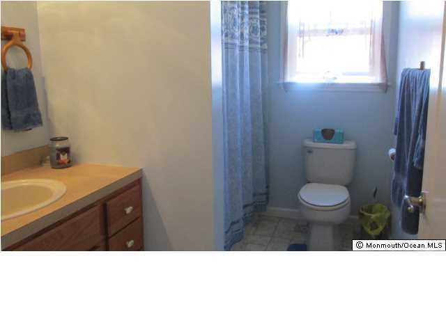 424 Diamond Road Jackson, NJ 08527 - Photo 10 of 22 a bathroom with a sink toilet and a mirror