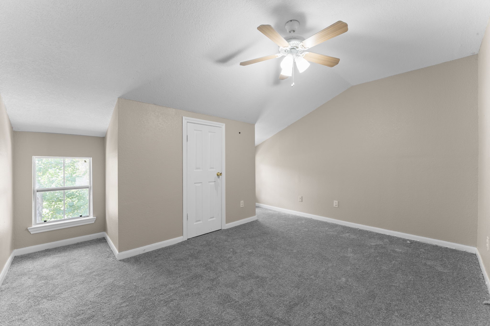 3145 Frick Road Houston, TX 77038 - Photo 5 of 10 an empty room with windows and fan