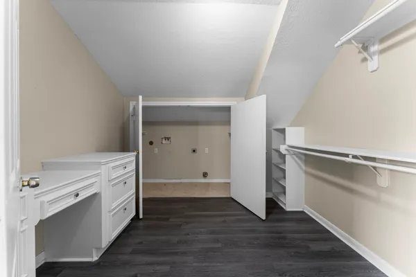 a view of cabinets and wooden floor