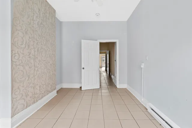 a view of an empty room and closet