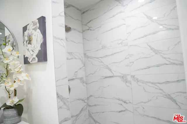 a view of a backyard with potted plants