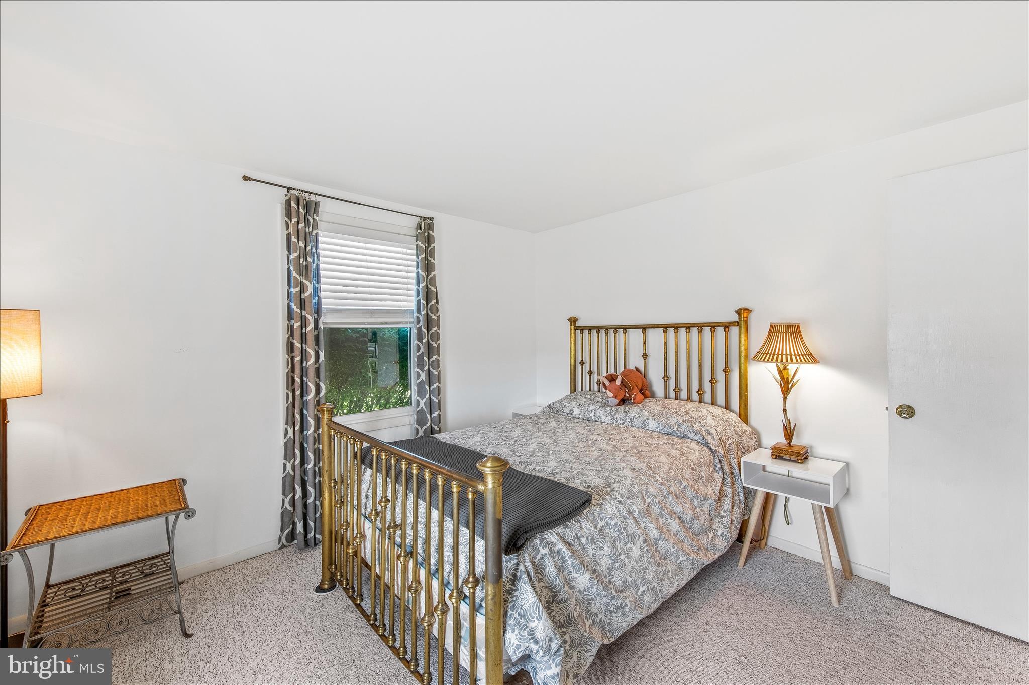 21406 Dogwood Cove Road Tilghman, MD 21671 - Photo 36 of 68 a bedroom with a bed and a window